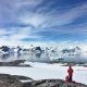 two persons standing on snow