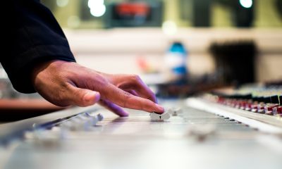 hand on music mixer