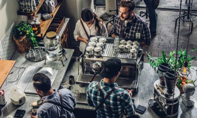 men preparing coffee for customers