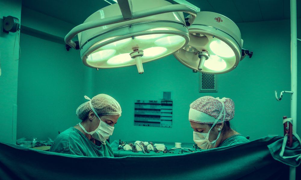 Two Person Doing Surgery Inside Room