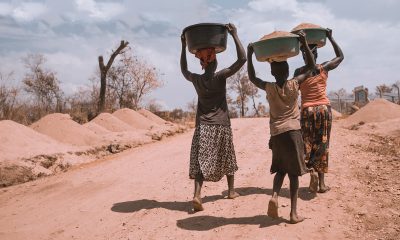 women carrying basin over their head