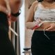 woman measuring waist with tape