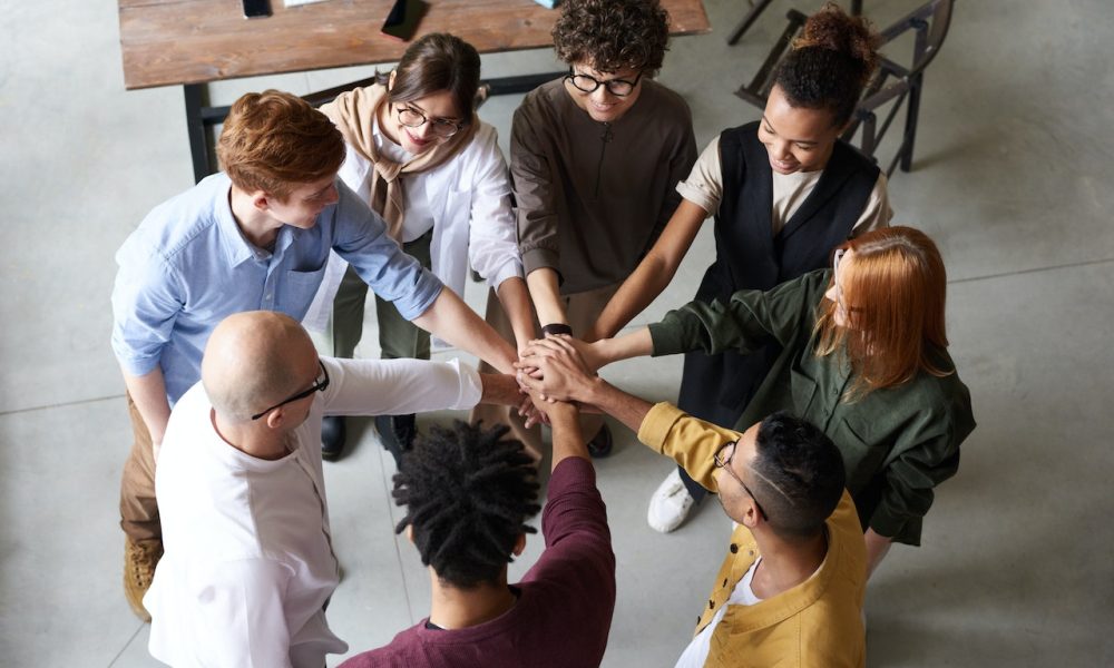 people holding out each other's hands