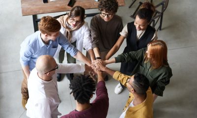people holding out each other's hands