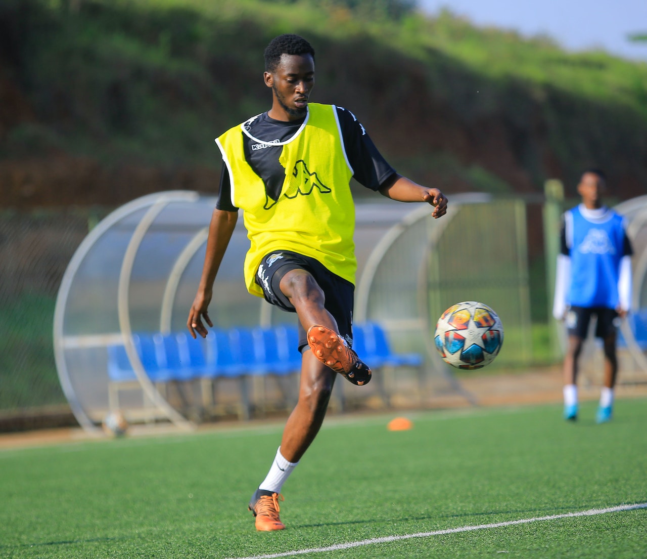 man on yellow jersey playing soccer