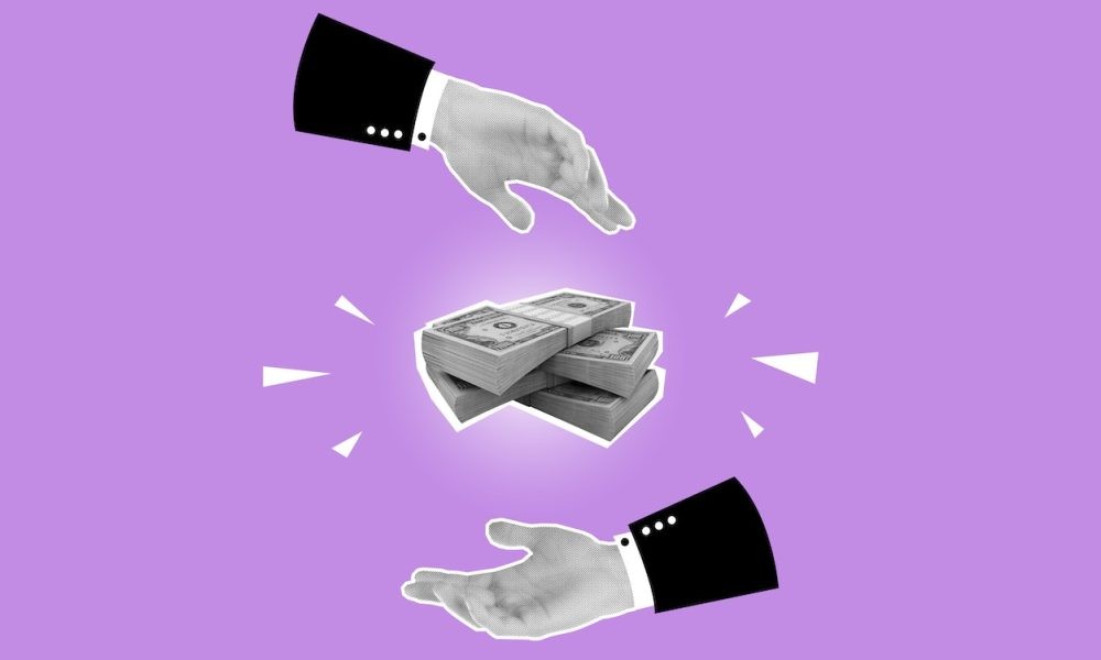 cut-out of hands and money