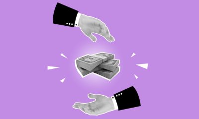 cut-out of hands and money