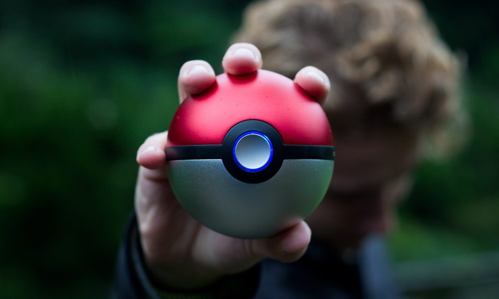 Person Holding Pokemon Ball Toy