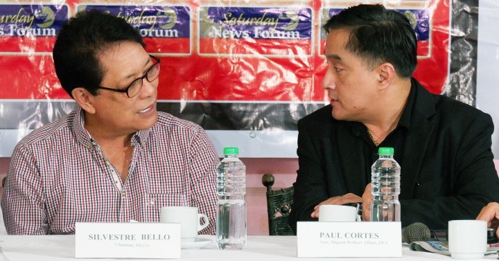 Manila Economic and Cultural Office chief Silvestre Bello III (left) chats with Foreign Affairs Assistant Secretary for Migrant Workers Affairs Paul Cortes