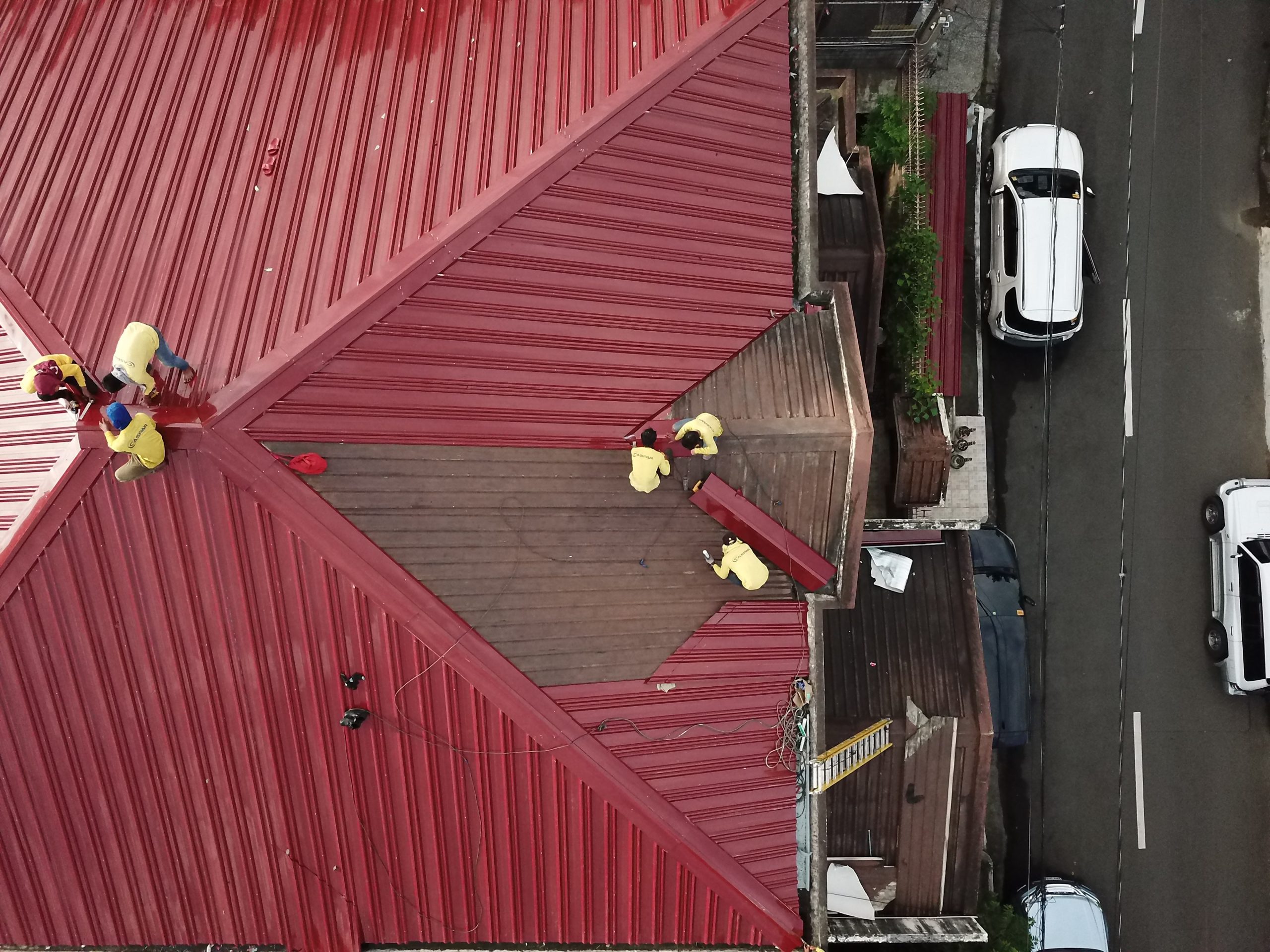 People Repairing House Roof