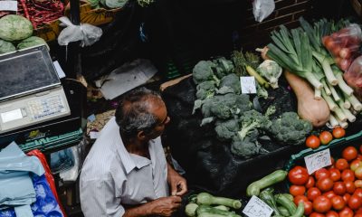 man standing at vegetables market
