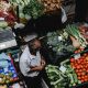 man standing at vegetables market