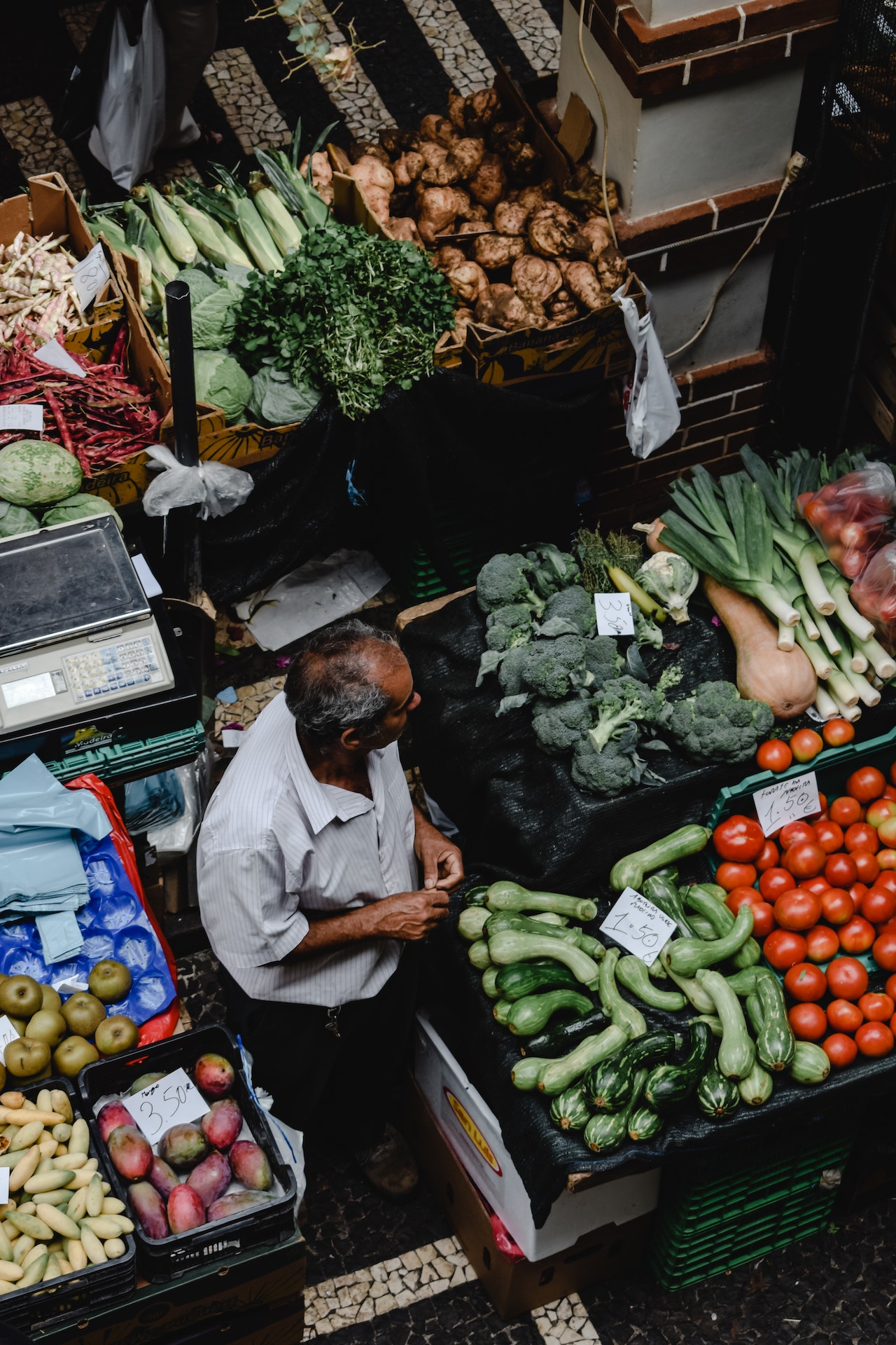 man standing at vegetables market