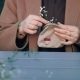 hands holding a coin purse