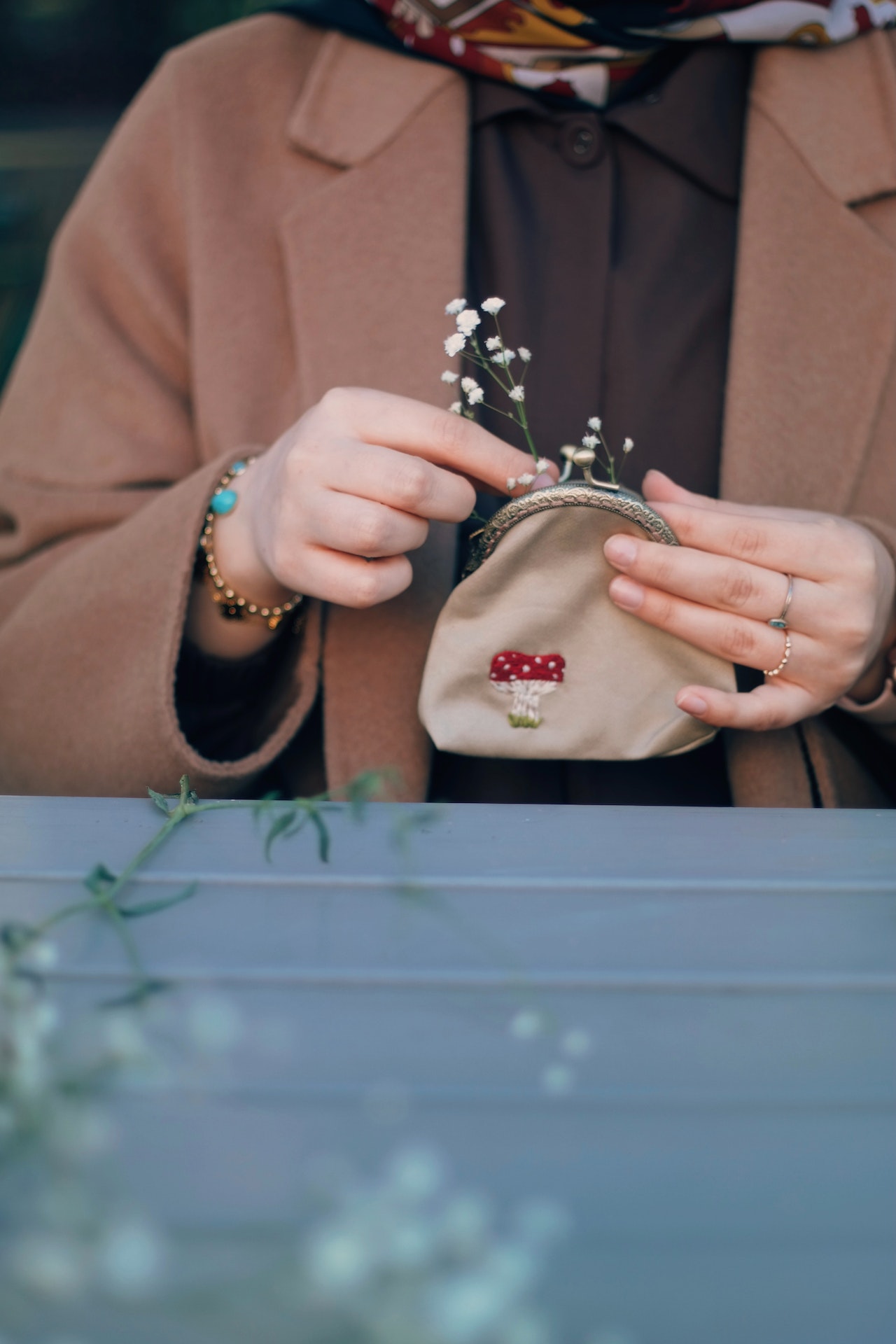 hands holding a coin purse