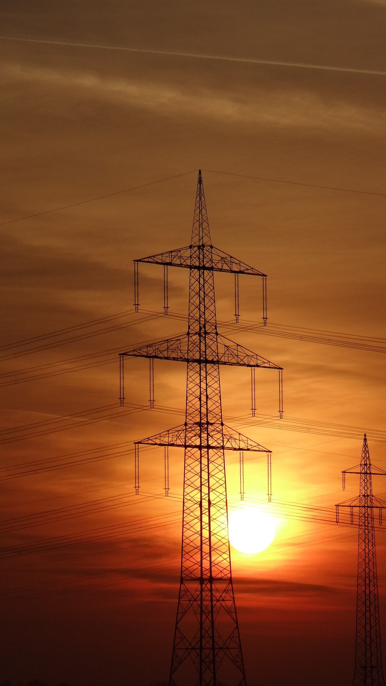 electric lines with sunset on background