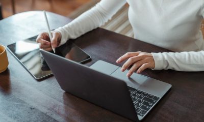 female hands working on laptop and ipad