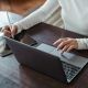 female hands working on laptop and ipad
