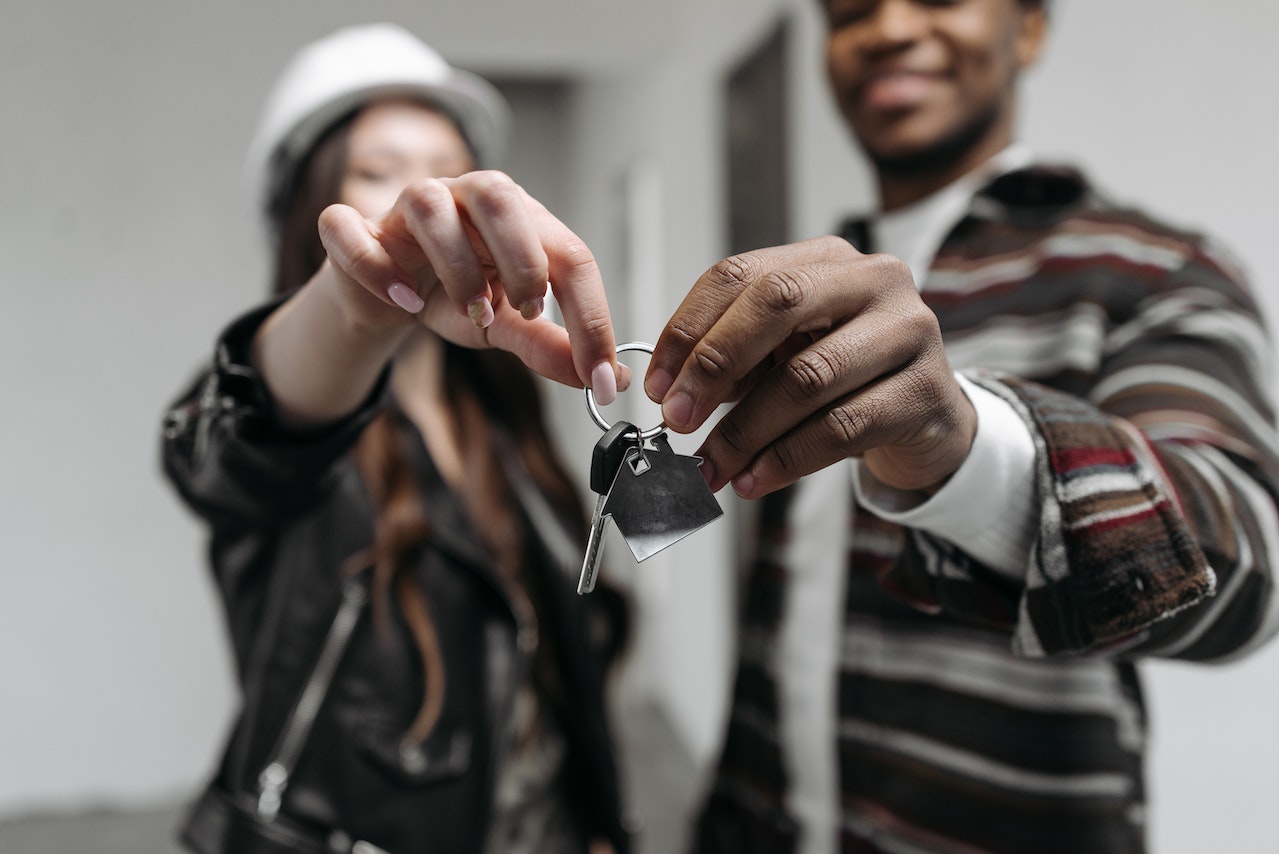 couple holding house key