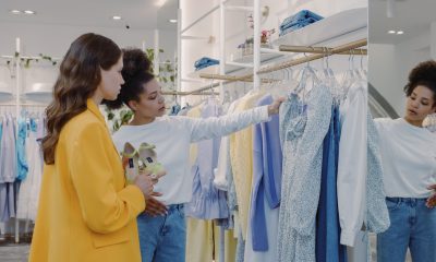 women looking at clothes at store
