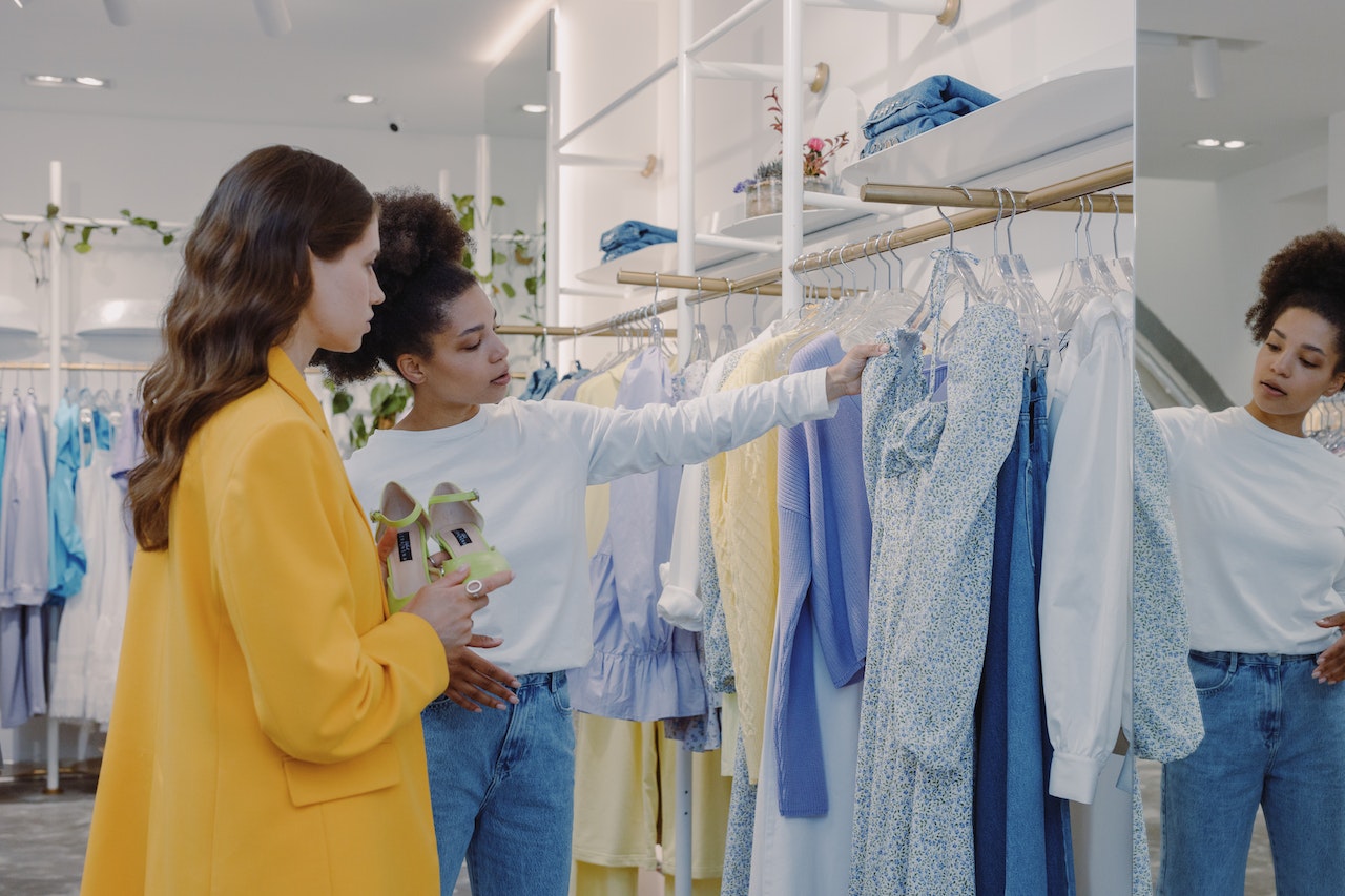 women looking at clothes at store