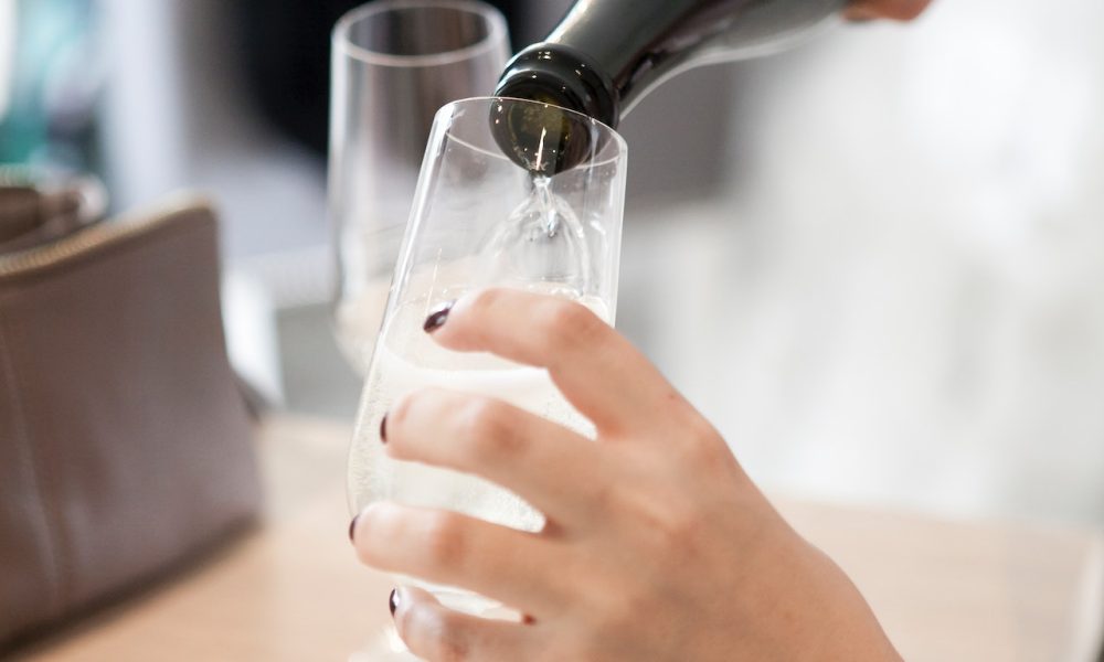 pouring wine on glass