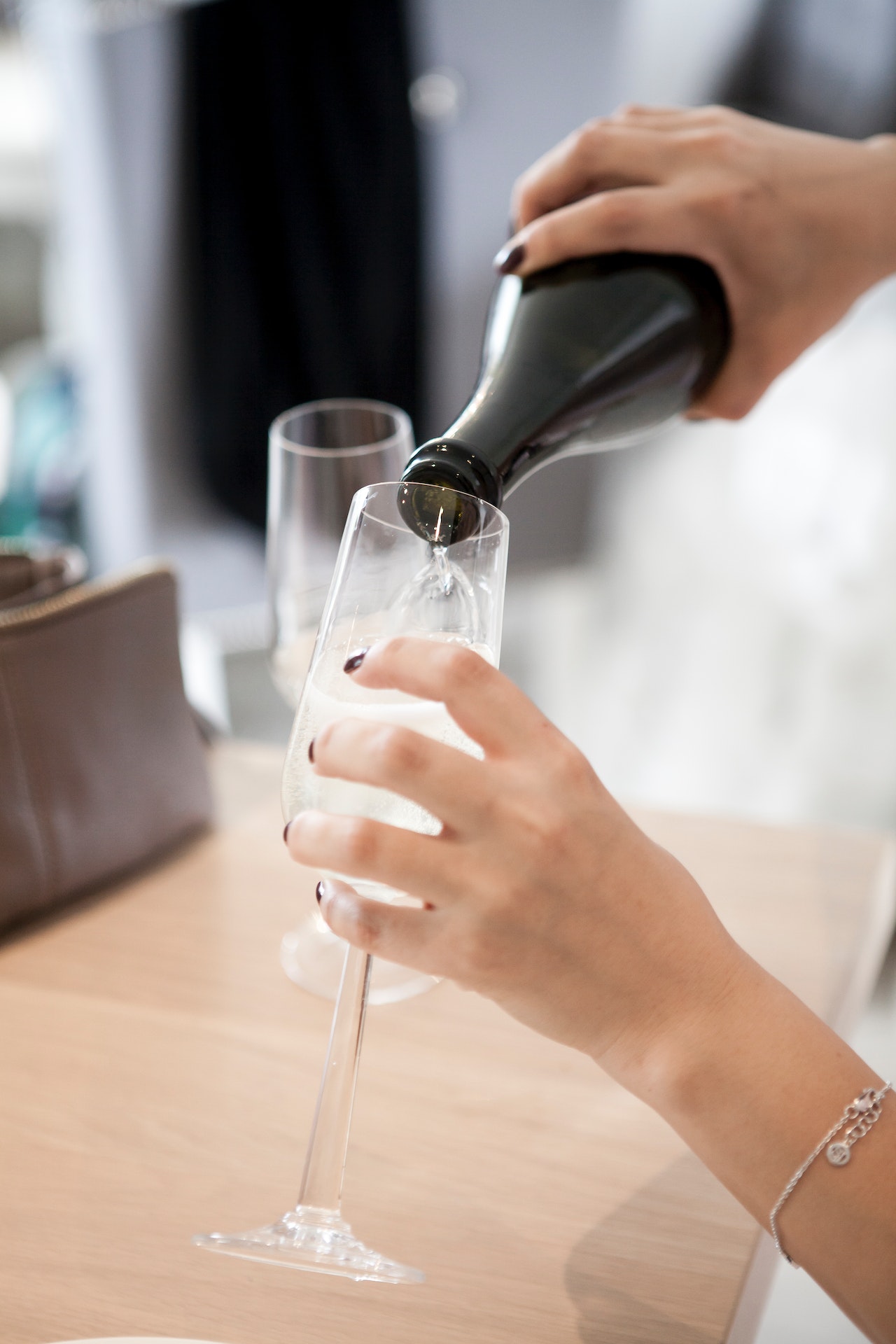 pouring wine on glass