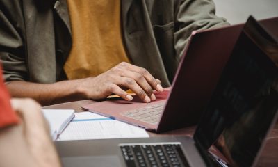 hands typing on laptop