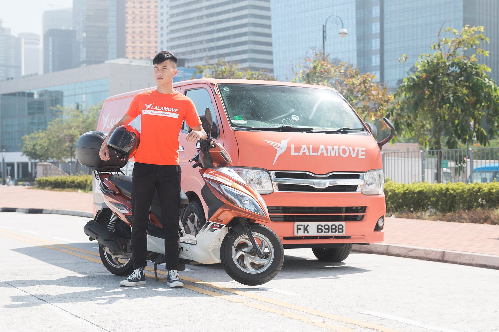 Lalamove delivery vehicles and driver in Hong Kong