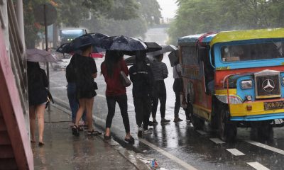 passengers riding jeep during rainy season
