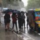 passengers riding jeep during rainy season