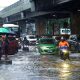 flooded street with cars and pedestrians