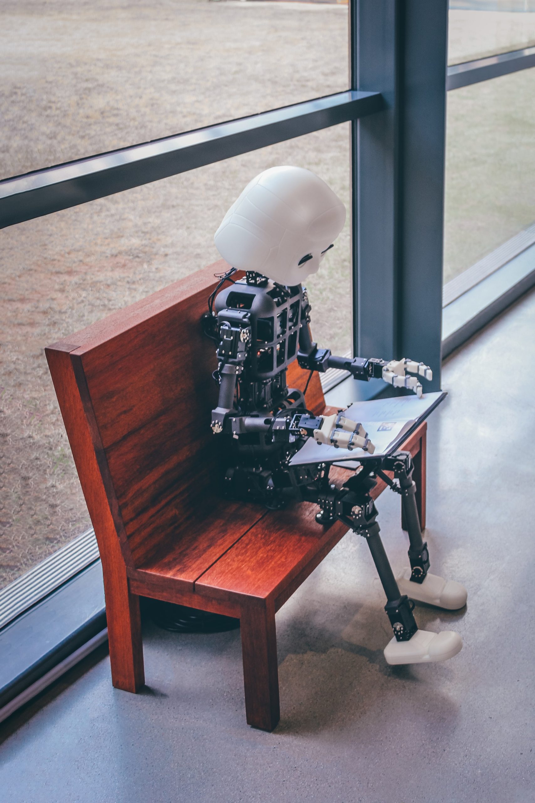 robot kid reading a book