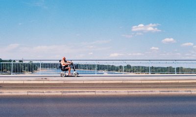 man driving along road