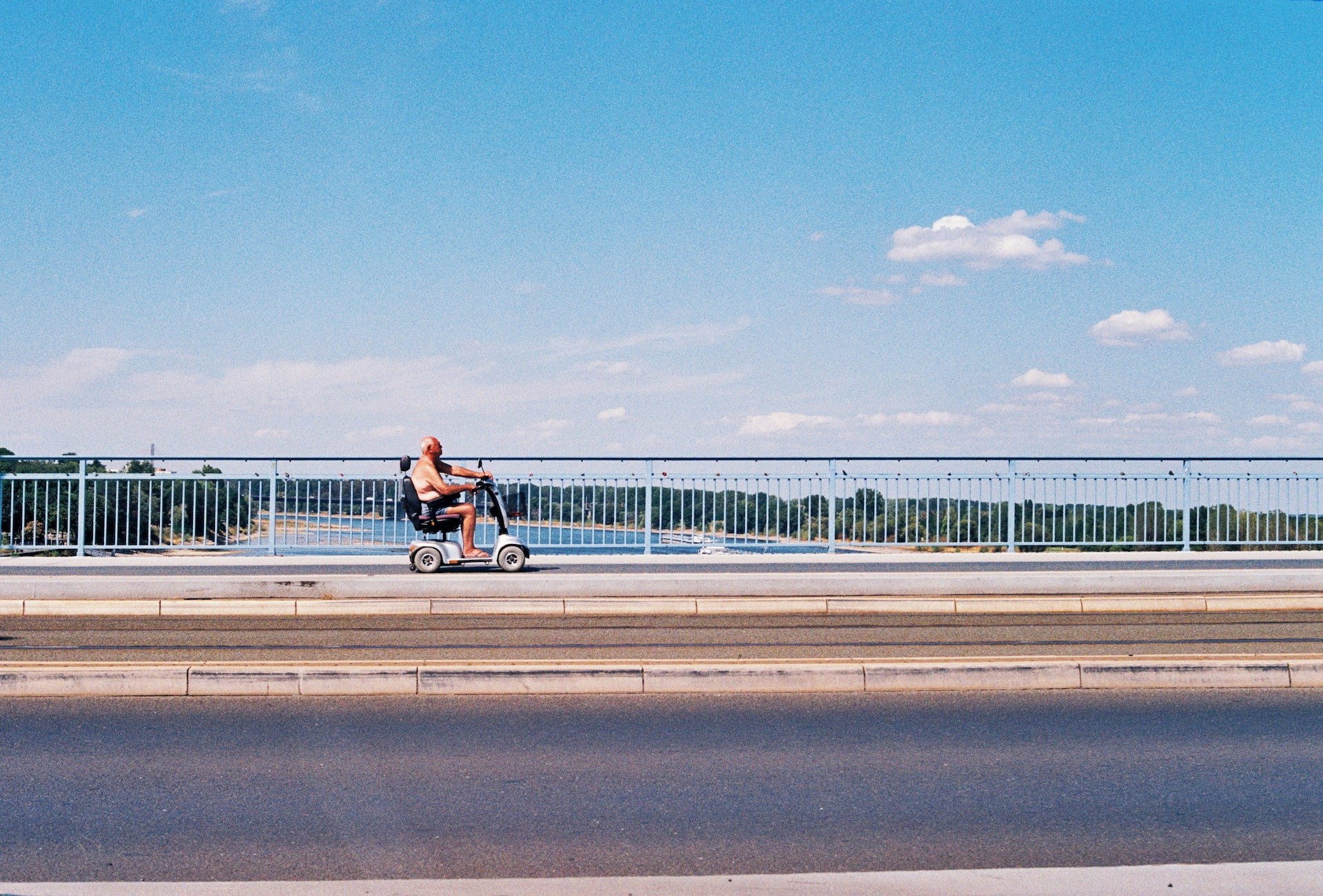 man driving along road