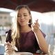 Woman in Purple Eating