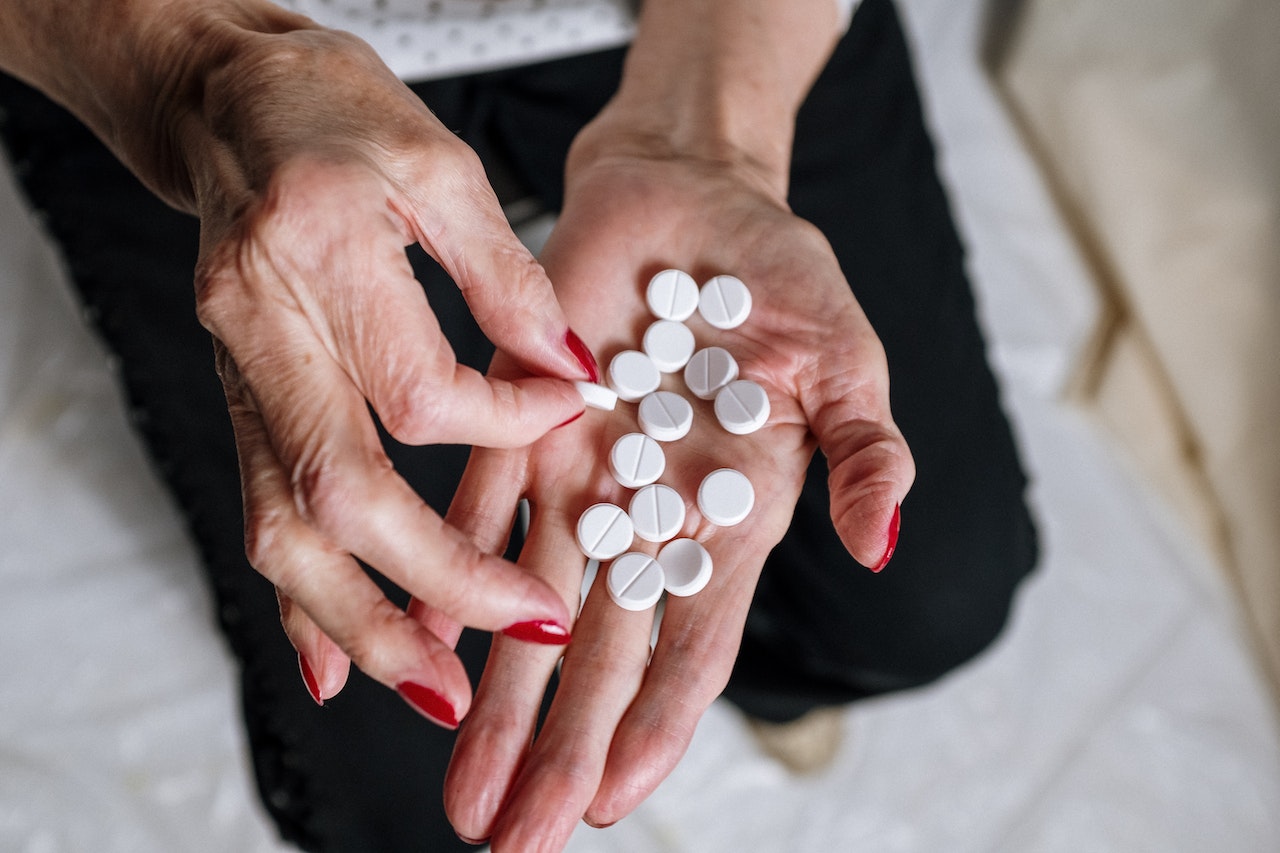 pills on hands