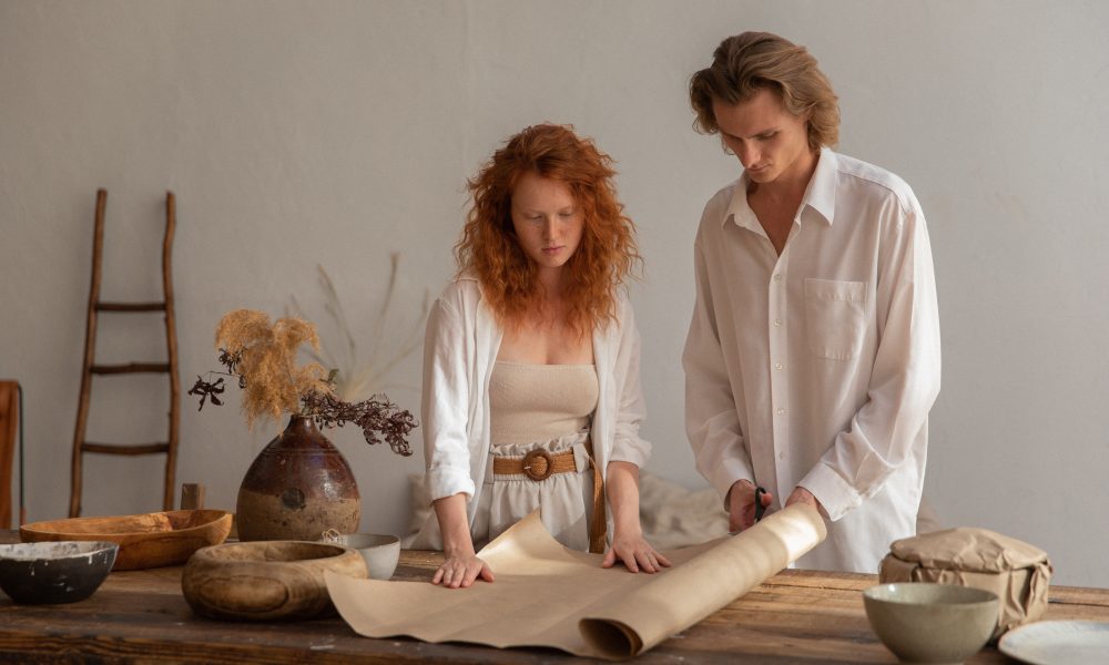 Concentrated couple cutting craft paper