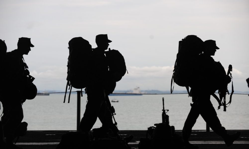 silhouette of soldiers walking