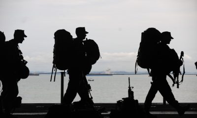 silhouette of soldiers walking