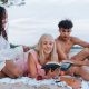 friends reading on beach