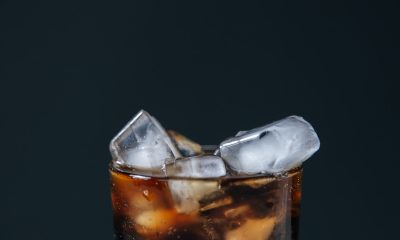 ice cubes and soft drink on glass