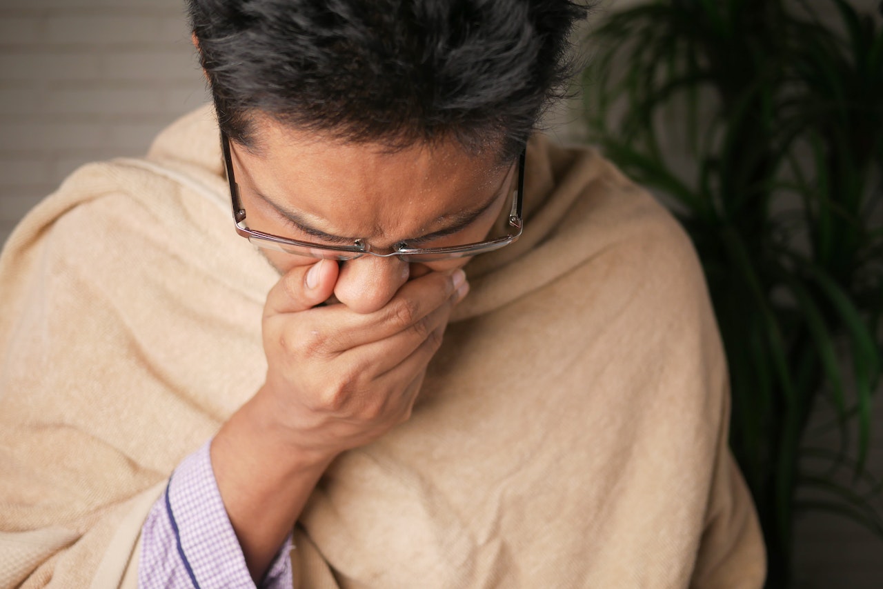 Man covering his mouth