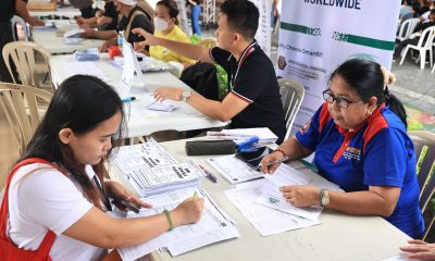 woman signing papers
