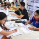 woman signing papers