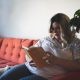 woman sitting on couch