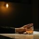 hand holding a glass of whisky