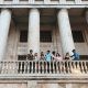 Photo of Couples Standing Near Railings