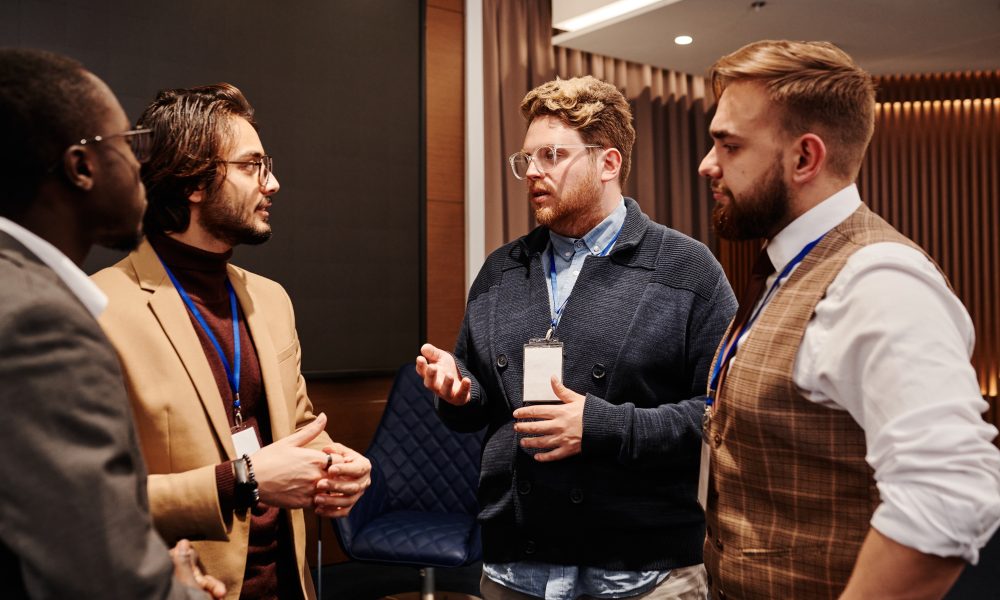 Men in Discussion at an Event