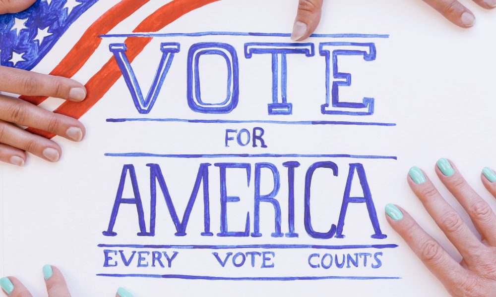 Close Up Photo of Vote Signage
